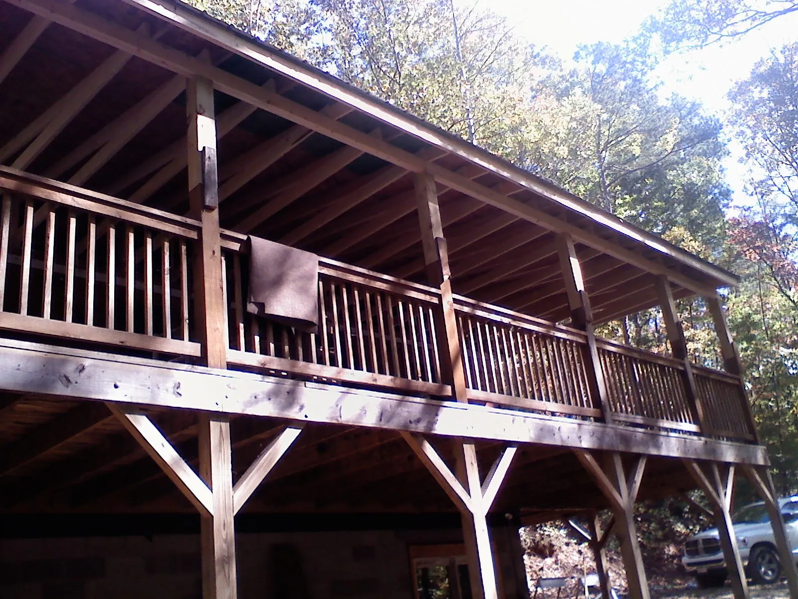 Timber framing under a new elevated porch and deck — Roof Leak Repair in Taos by Roofing Brothers